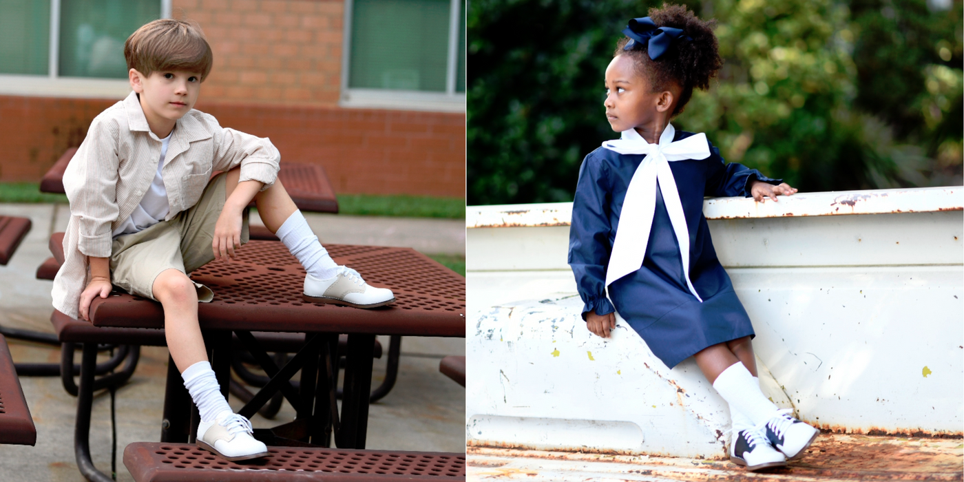 A two image collage of young girl (right) and young boy (left) each wearing a Footmates "Cheer" Saddle shoe.  The girl is wearing the "8401" White/Navy saddle.  The boy is wearing the "8404" White/Ecru saddle.  There is a clickable link in the center of the collage image to "Shop Footmates Cheer Saddle Shoes".